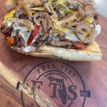 BBQ Pork Cheesesteak Toasted Amoroso Roll, Mojo Roasted Pork, Grilled Onions & Red Pepper, BBQ Sauce, FTS Cheese Sauce, Crispy Onion Strings,  Banana & Cherry Pepper Blend