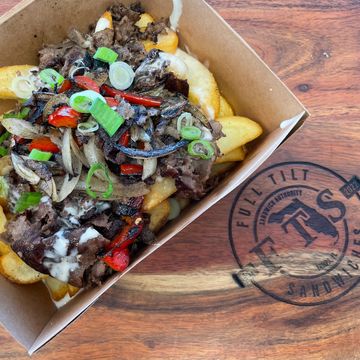 Philly Fries Mojo Seasoned Fries Topped With, Grilled Onions & Red Bell Pepper, Shaved Sirlon