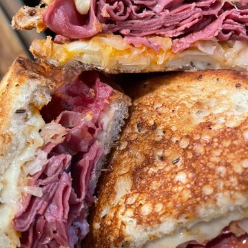 Reuben Butter Toasted Rye, Swiss, Caraway Kraut, Reubie Sauce, Shaved Corned Beef