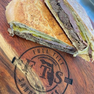 Cuban Sandwich Buttered Pressed Cuban Bread, Shaved Mojo Pork, Smoked Ham, Swiss, Dill Pickle.
