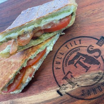 Ca"press"e sandwich Buttered Pressed Cuban Bread, Basil Pesto, Fresh Mozzarella, Vine Ripe Tomatoes