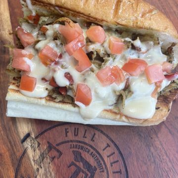 Pesto Chicken Cheesesteak Toasted Amoroso Roll, Grilled Shaved Chicken, Grilled Onion & Red Peppers