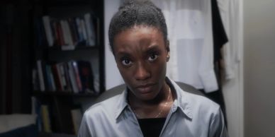 Serious woman looking intensely at the camera indoors.