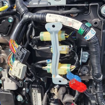 Close-up of colorful wiring and connectors on a marine engine.