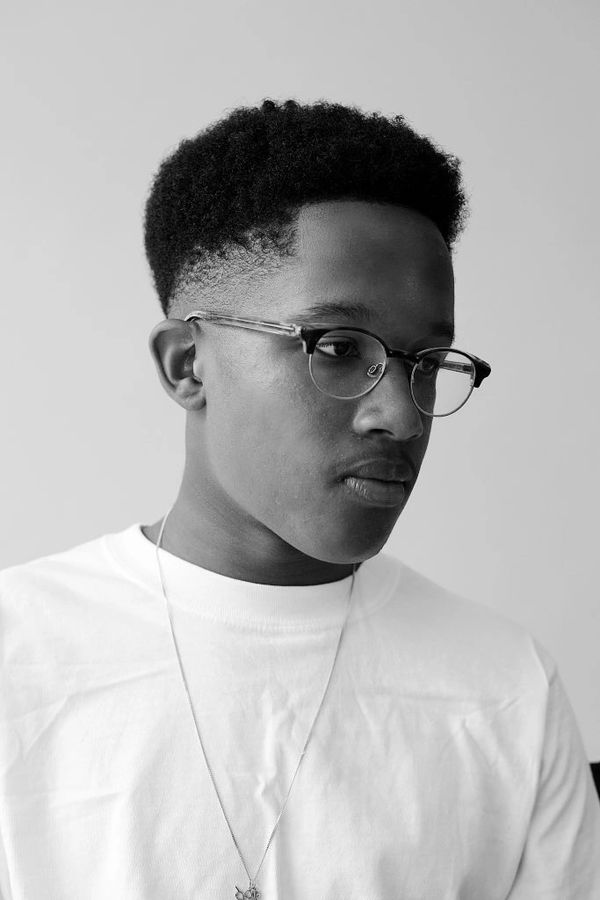 Mid skin fade. Afro texture hair. Line up