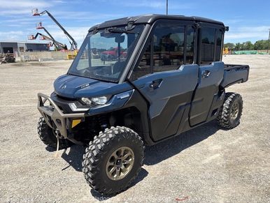 Black all-terrain vehicle on gravel surface.
