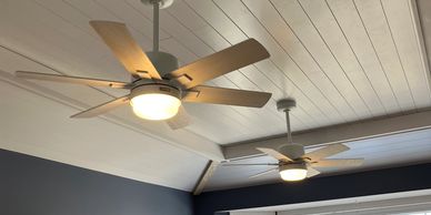 Two ceiling fans installed in a customer's home.