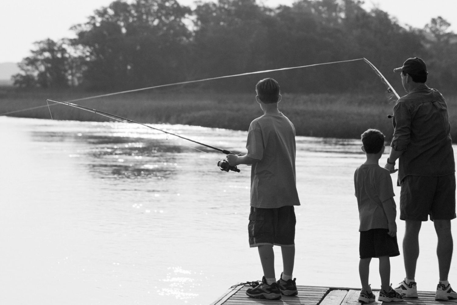 father and sons fishing using a june bug spinner lure