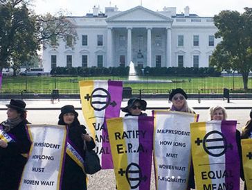 Protesters advocating for women's rights in front of the White House.