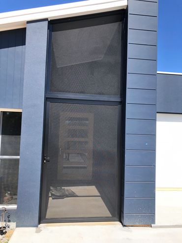 Blue exterior wall with sliding mesh door.