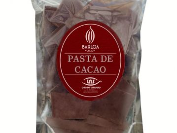 Packaged blocks of cacao paste labeled Barloa Cacao.