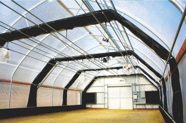 Another angle of the polycarbonate greenhouse with the black-out shade system