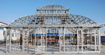 Victorian greenhouse in the midst of construction. The glass is not yet added.