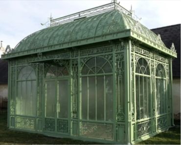 Victorian Gothic greenhouse with a beautiful patina colored powder coating