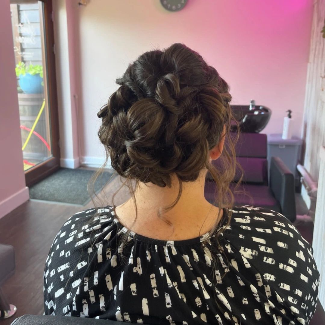 Curled and pinned occasion updo styled at Secret Escape hair salon near Royston