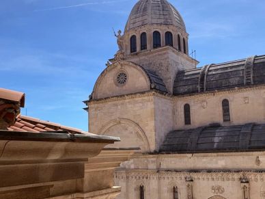 Historic dome and architecture under clear blue sky.