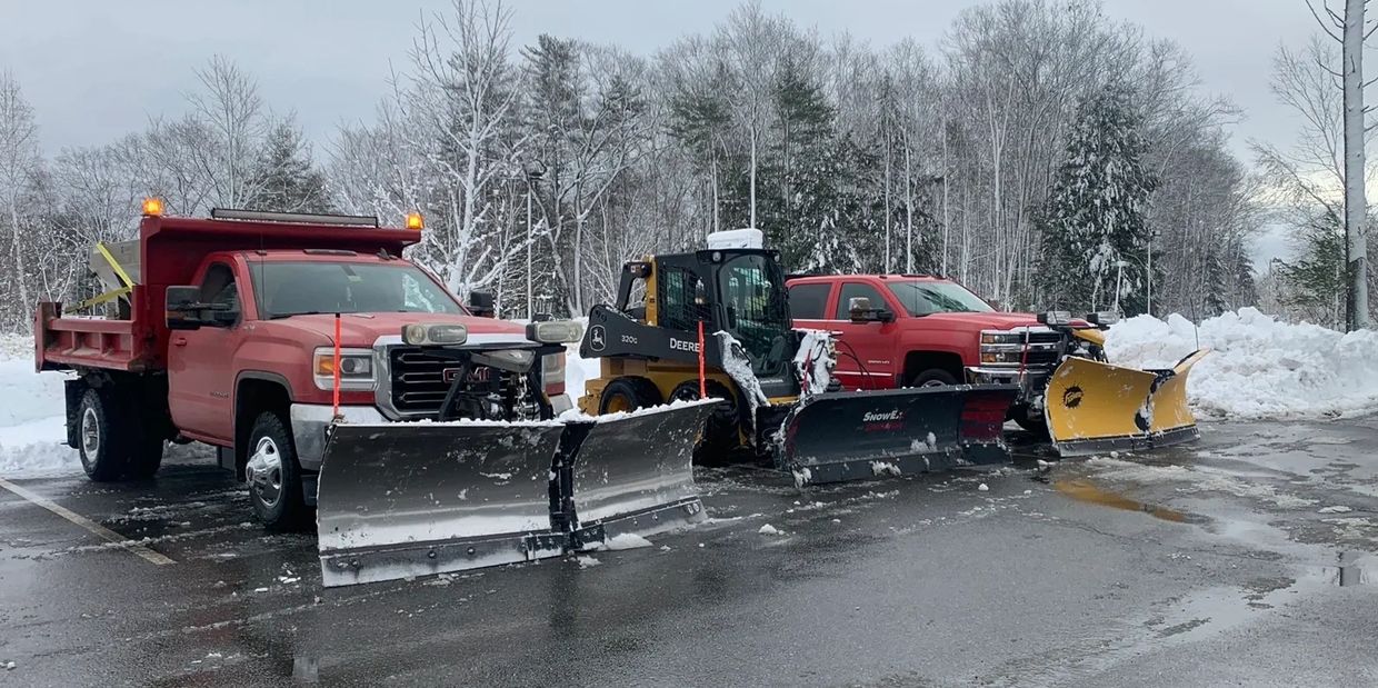 Plowing and commercial parking lot in Waterville, Maine