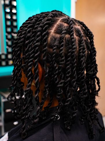 Close-up of neatly twisted black hair styled with precise parting.