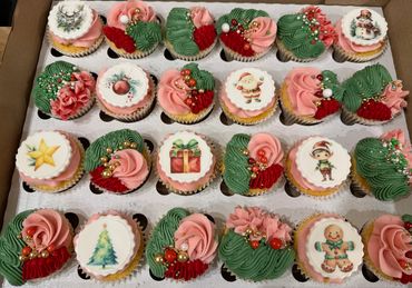 Festive Christmas cupcakes with holiday-themed decorations and frosting.