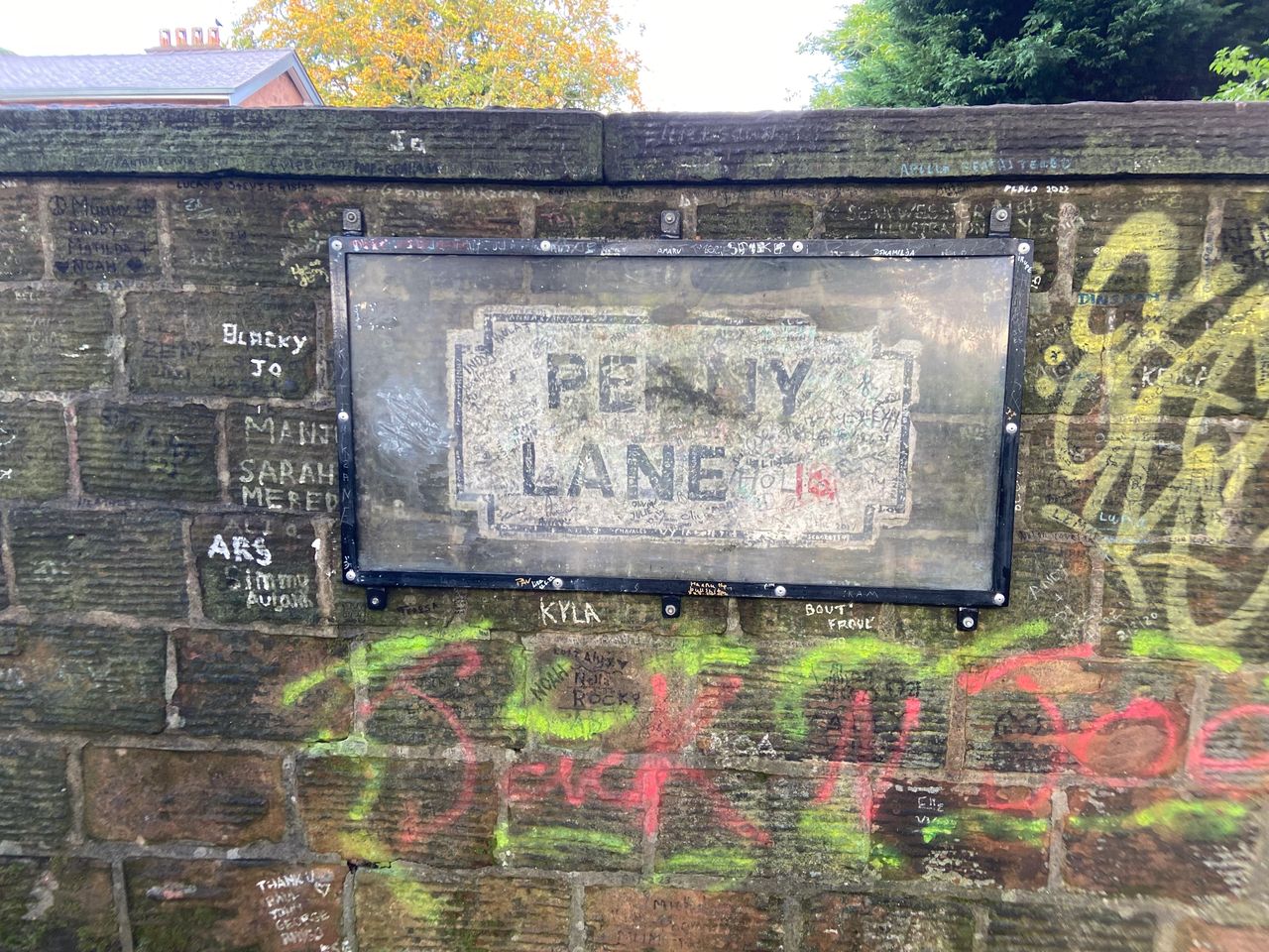 Inspiration for the song Penny Lane surrounds you as you drive down the road. Look closely at this sign, and you might see the Paul McCartney autograph.