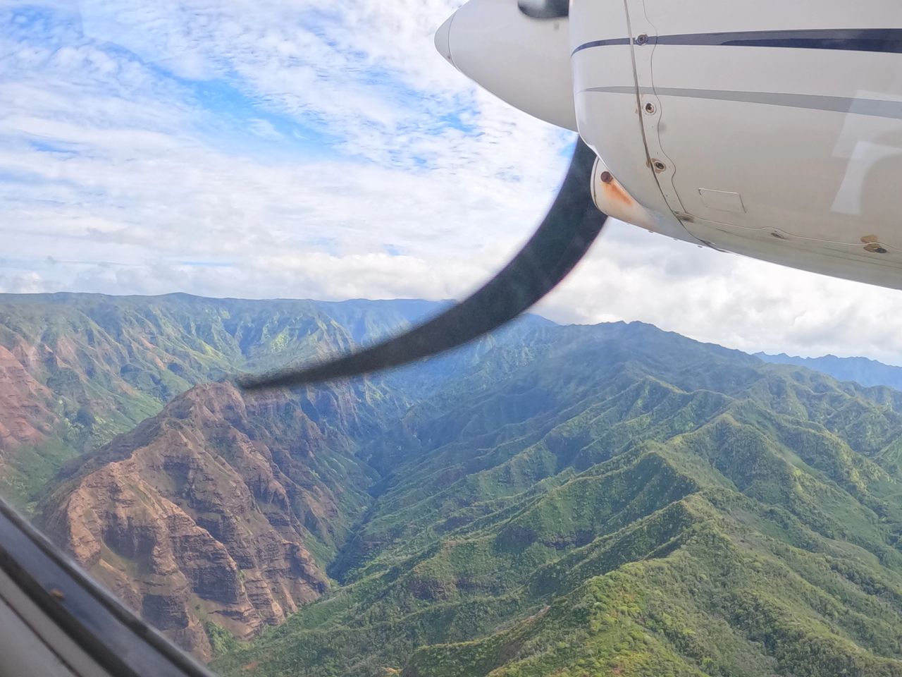 Helicopter tours advertise better views, but at a higher cost. The airplane was not really a hinderance in seeing the Kauai Hawaii beauty or getting adequate photos.