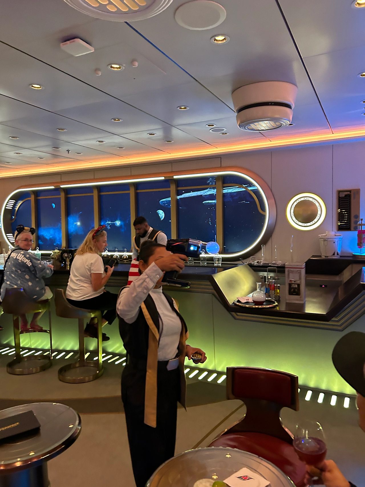 Catch a sphere of smoke and enjoy a Star Wars themed drink at the Hyperspace Lounge. This is the coolest bar you’ll find on board the Disney Wish.