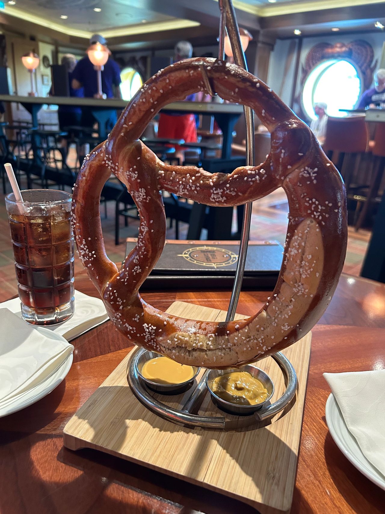 Enjoy a filling Bavarian pretzel with your beverage, and enjoy the latest sporting event at Keg & Compass. If you’re on board the Disney Wish during a big sporting event, this is the place to go to catch all the action.