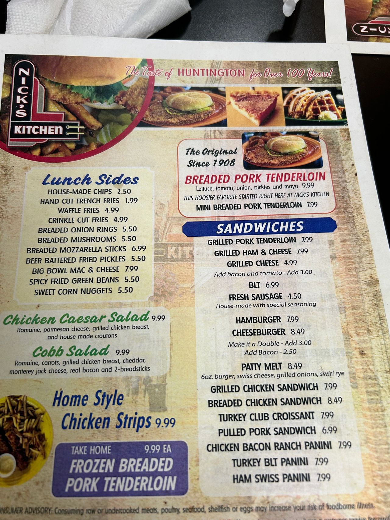 The lunch menu from Nick’s Kitchen in downtown Huntington, Indiana. Known as the birthplace of the breaded pork tenderloin sandwich, they offer a wide variety of options for breakfast and lunch. The lunch menu from Nick’s Kitchen in downtown Huntington, Indiana. Known as the birthplace of the breaded pork tenderloin sandwich, they offer a wide variety of options for breakfast and lunch.