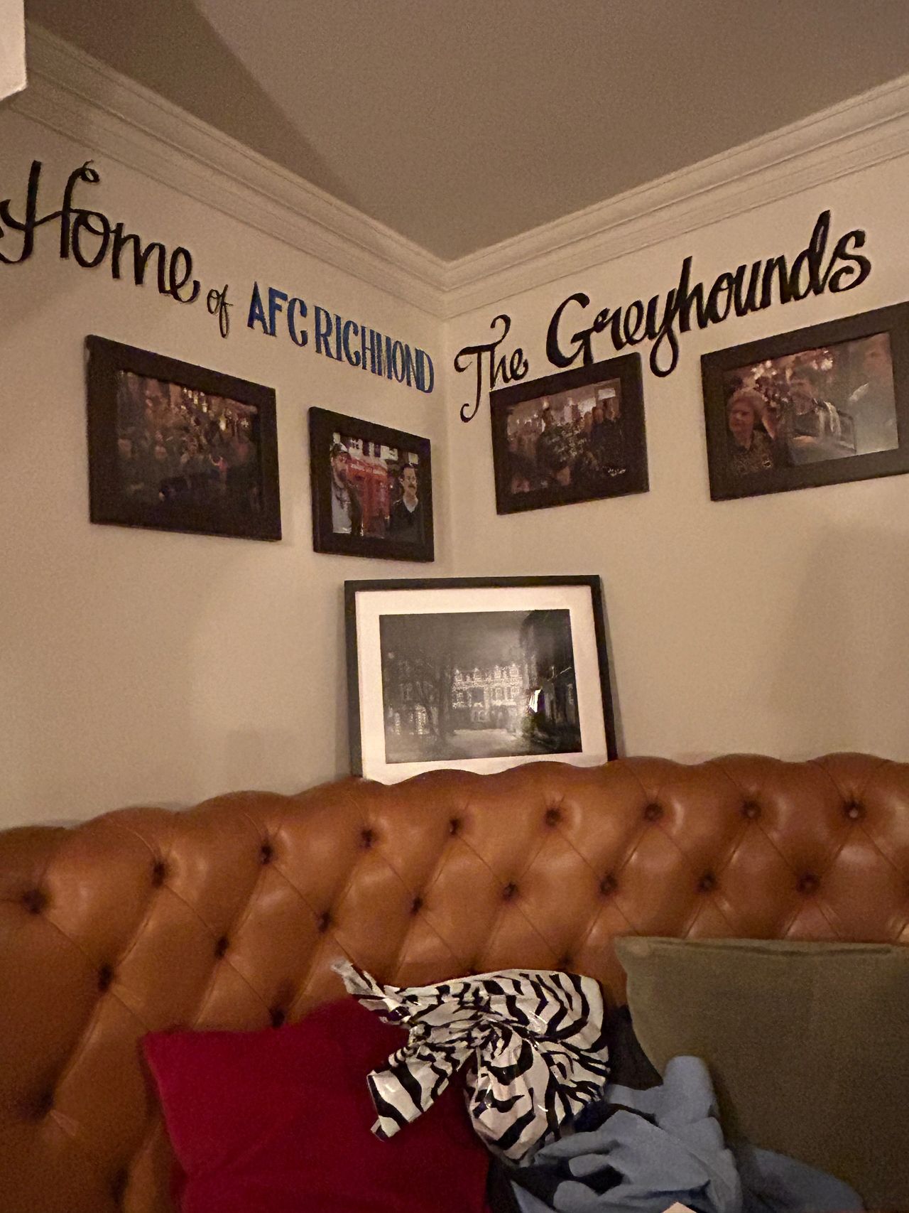 AFC Richmond is not a real football team. But you'll find plenty of team memorabilia throughout the pub. This corner booth has become a mini-shrine to the show with photos of your favorite characters. 