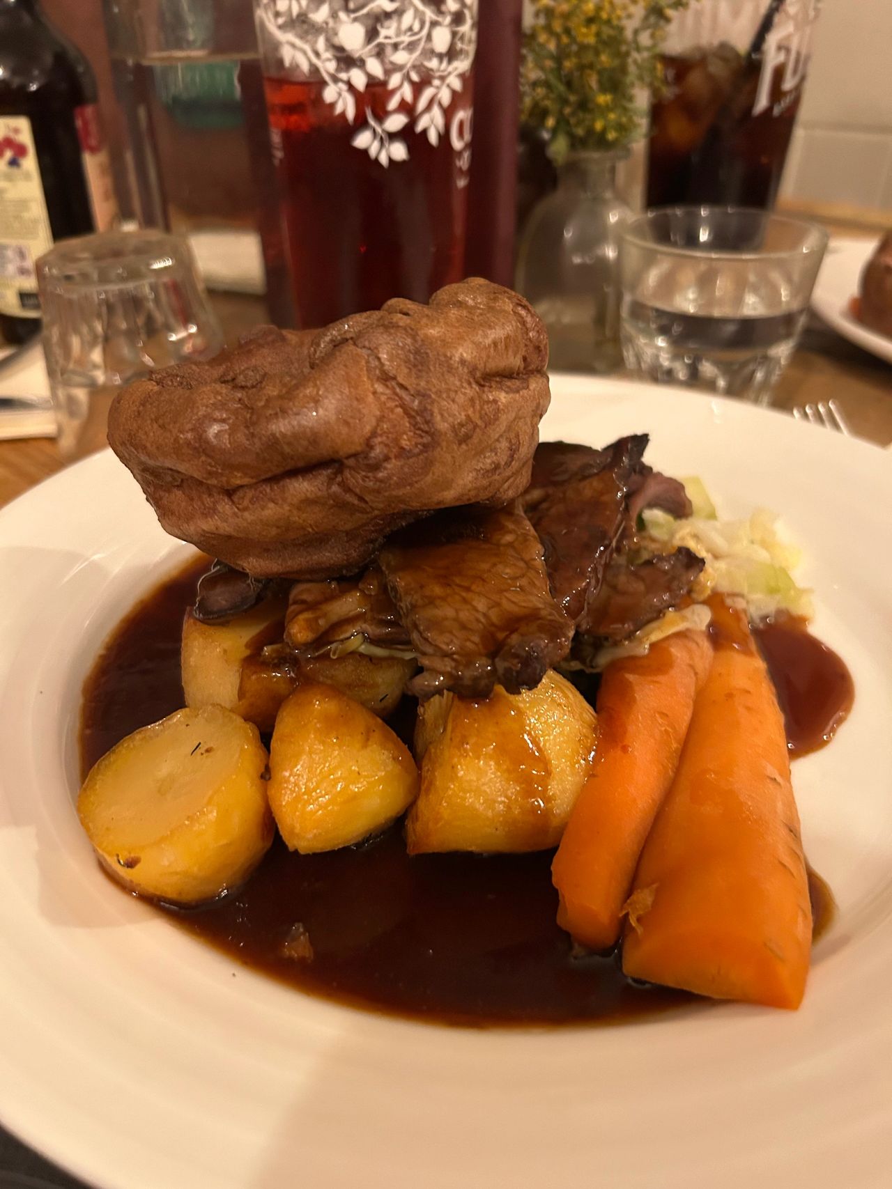 The traditional sirloin of beef Sunday roast served at the Prince's Head in Richmond, UK. It is topped by the light and fluffy Yorkshire pudding.
