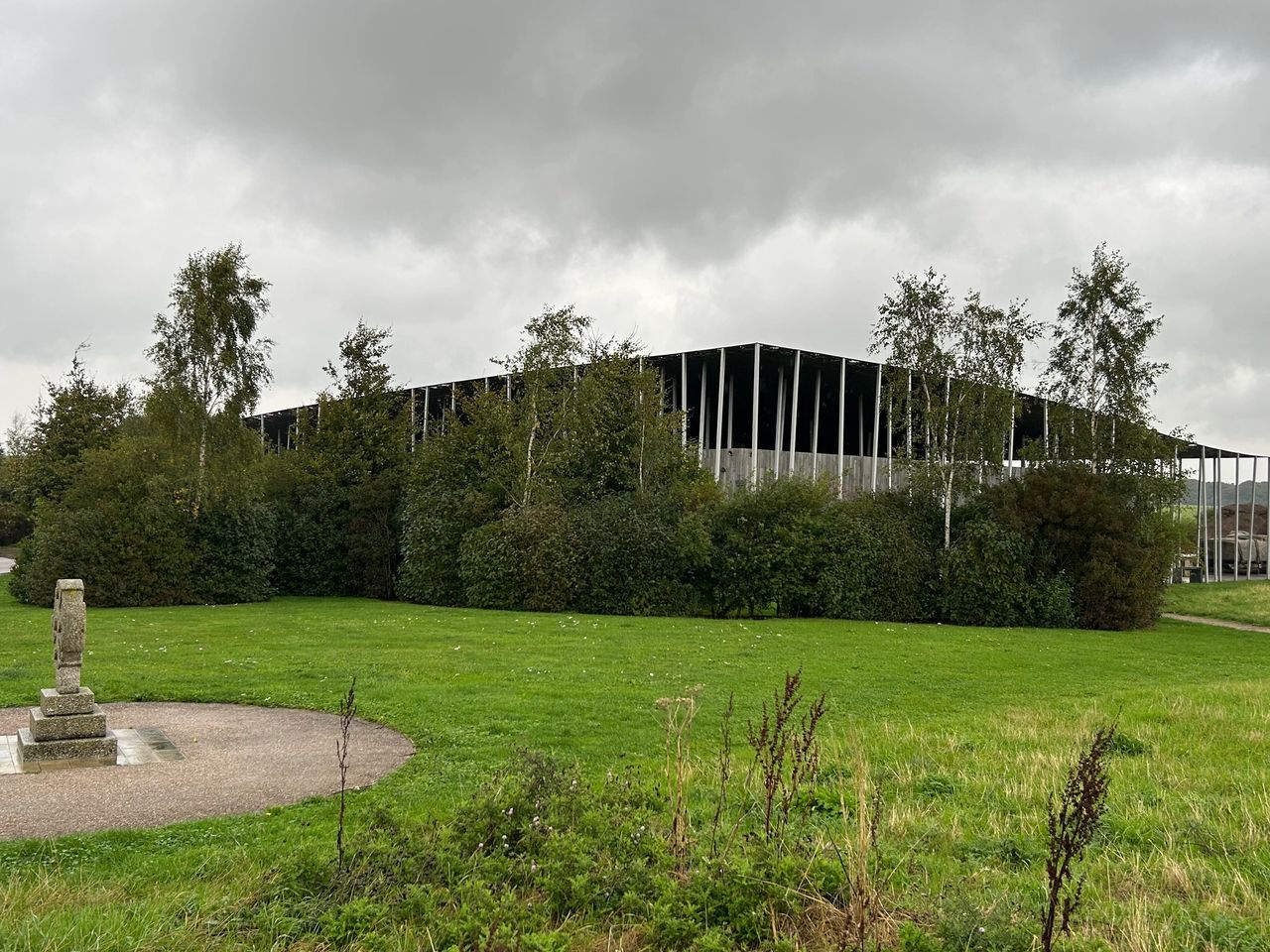 Approaching the visitor's center at Stonehenge which was built in 2013. From there you can catch a tram to the monuments, tour the museum, enjoy a snack or shop the gift shop.