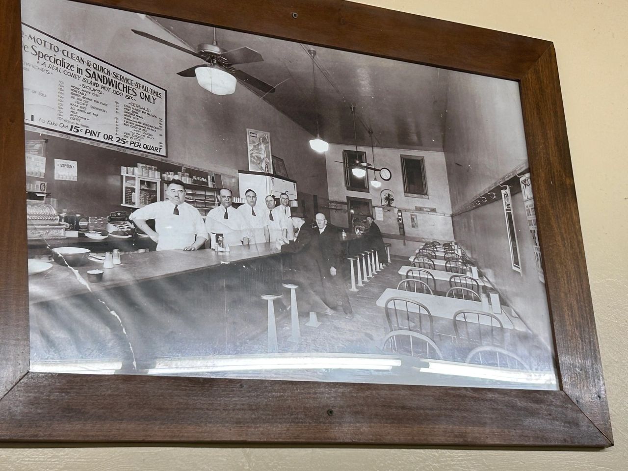 The walls of Coney Island are filled with historic photos of the establishment. The staff dresses more casually now, which is the only thing that has changed from this photo.