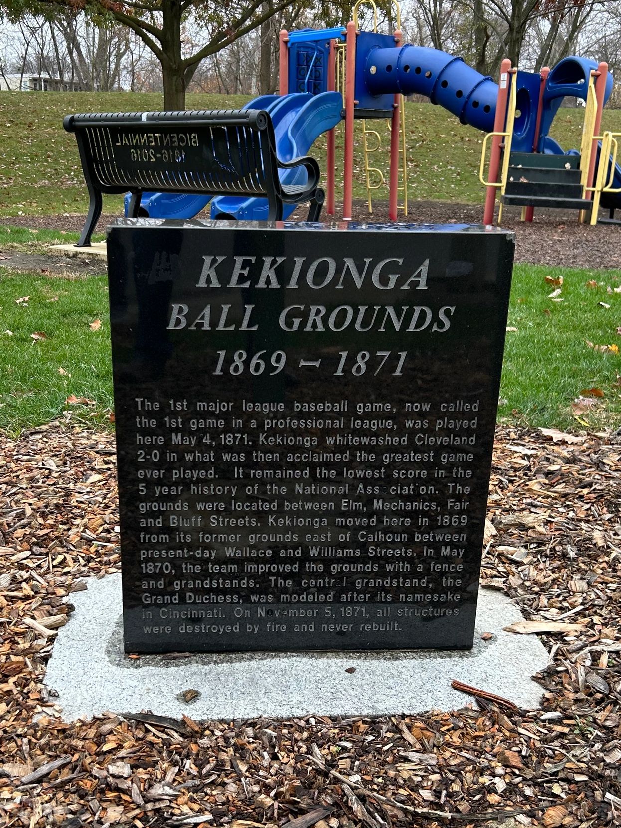 The site of the first game of the modern day Major League Baseball is now a small city park in Fort Wayne, Indiana. No remnants of a baseball diamond remains, only this small monument with details of the game.