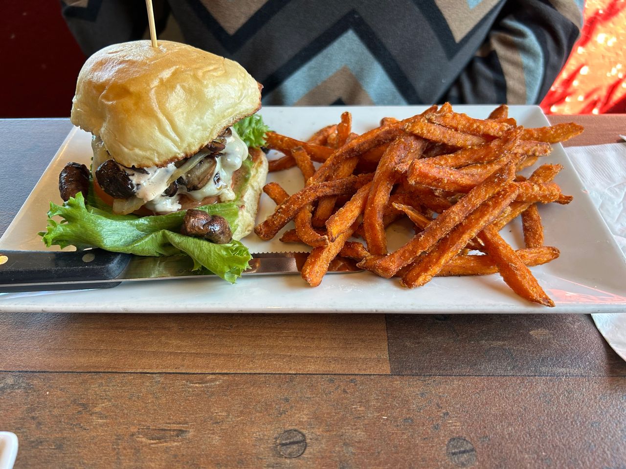 GAS - Full Service Restaurant offers amazing gourmet burgers, including this mushroom Swiss burger served with sweet potato fries.