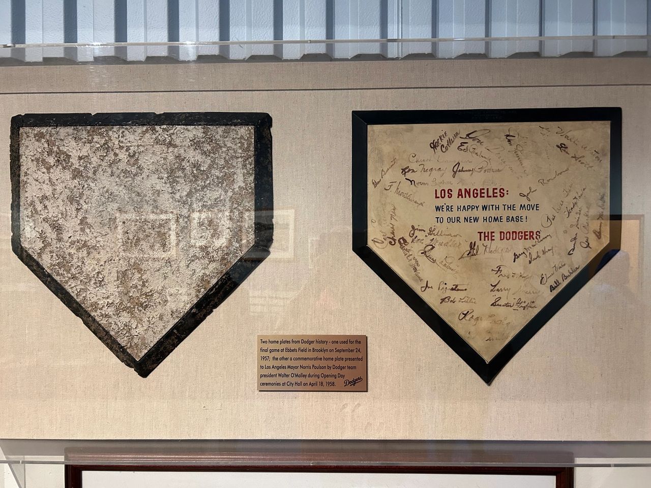The last and first home plates of the Dodgers. On the left is the last home plate taken from Brooklyn's famous Ebbett's Field after the 1957 season. On the right, a commemorative home plate in honor of the Dodgers 1958 debut in California.