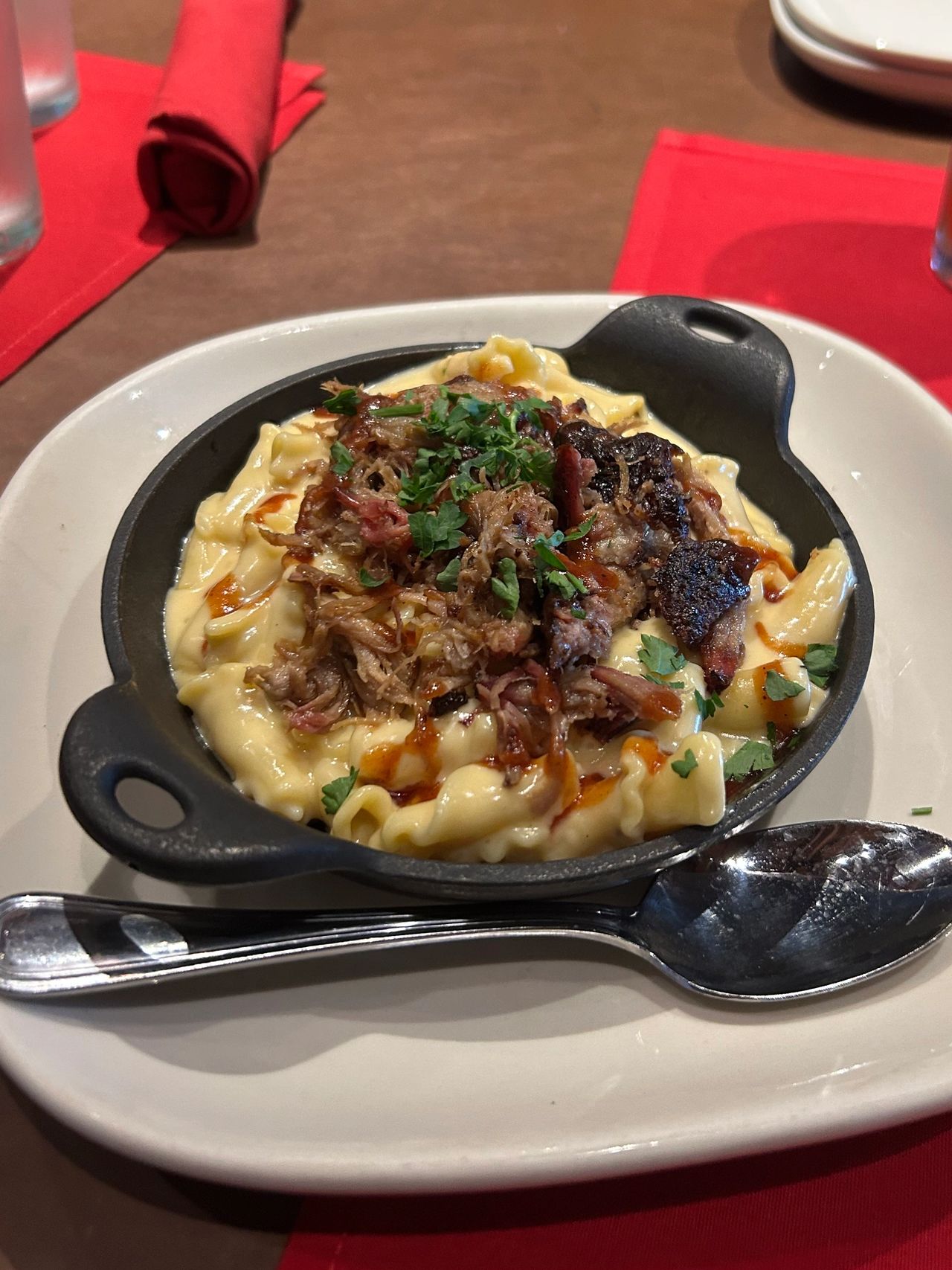 Creamy mac 'n cheese and hickory smoked pulled pork is a perfect combination, and a highlight of the Jack Stack Barbecue menu.