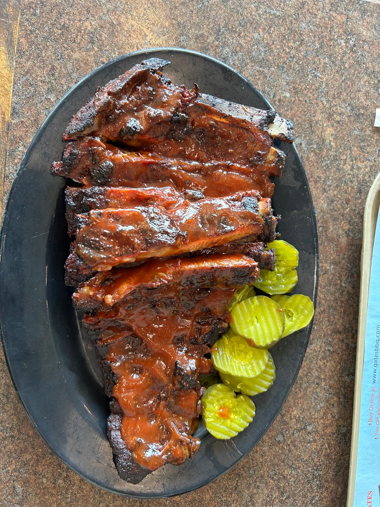 A full slab of ribs drenched in the spicy Gates sauce is a Kansas City tradition.