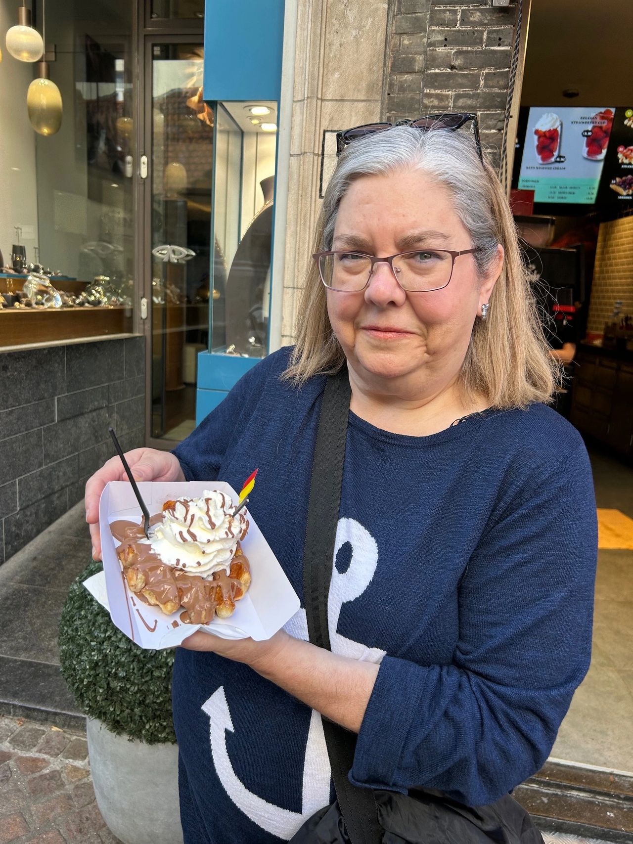 The perfect way to start a morning in Belgium, with a waffle covered in chocolate and whipped cream from Chez Albert near the Markt Square in Bruges. The perfect way to start a morning in Belgium, with a waffle covered in chocolate and whipped cream from Chez Albert near the Markt Square in Bruges.