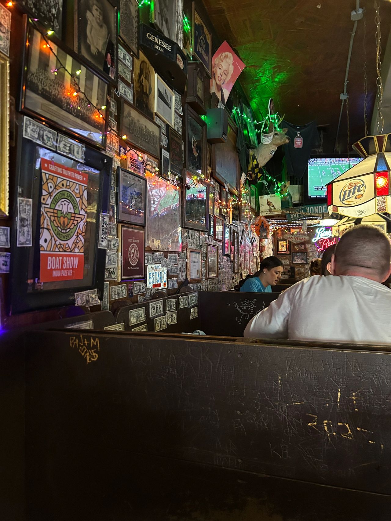 Even though it is a bar, the Thurman Cafe is family-friendly during the day. The atmosphere is relaxed, with the walls decorated with Ohio State memorabilia and signed dollar bills. 