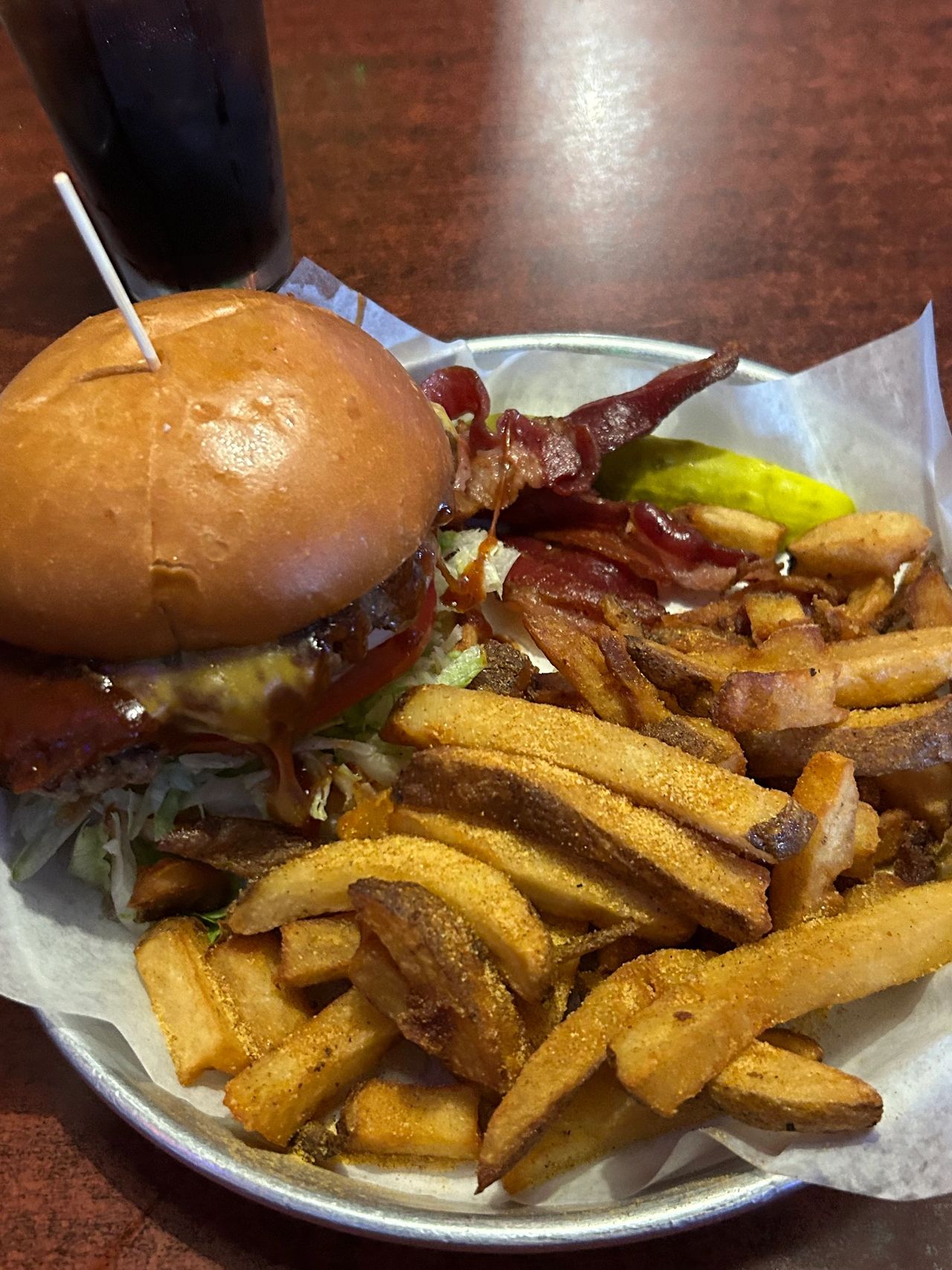 The Western Burger with hand-cut fries from the Thurman Cafe. Highlights include the fresh burger, never frozen and delivered each day, along with tasty thick-cut bacon and a delightful bbq sauce. 