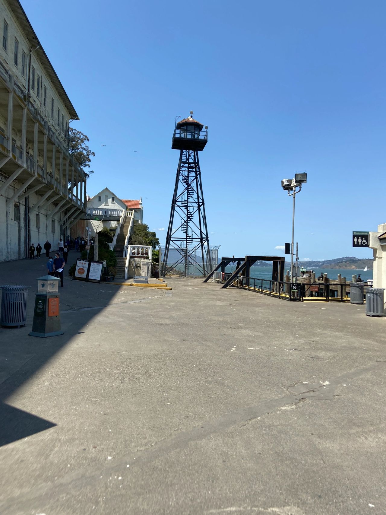 The bottom of the hill, near the pier where you come on Alcatraz Island. You can walk up the steep hill yourself or take the tram which will drop you off at the prison.