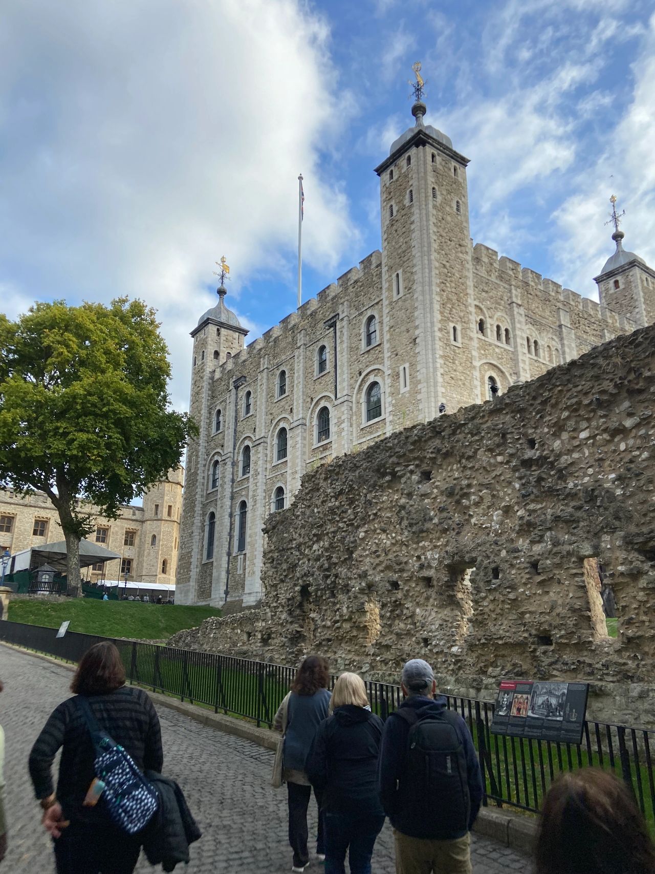 A section of the Roman wall built around AD200 to protect the city of London stands in front of White Tower. The White Tower was the first section of the Tower of London built, dating back to AD1066.