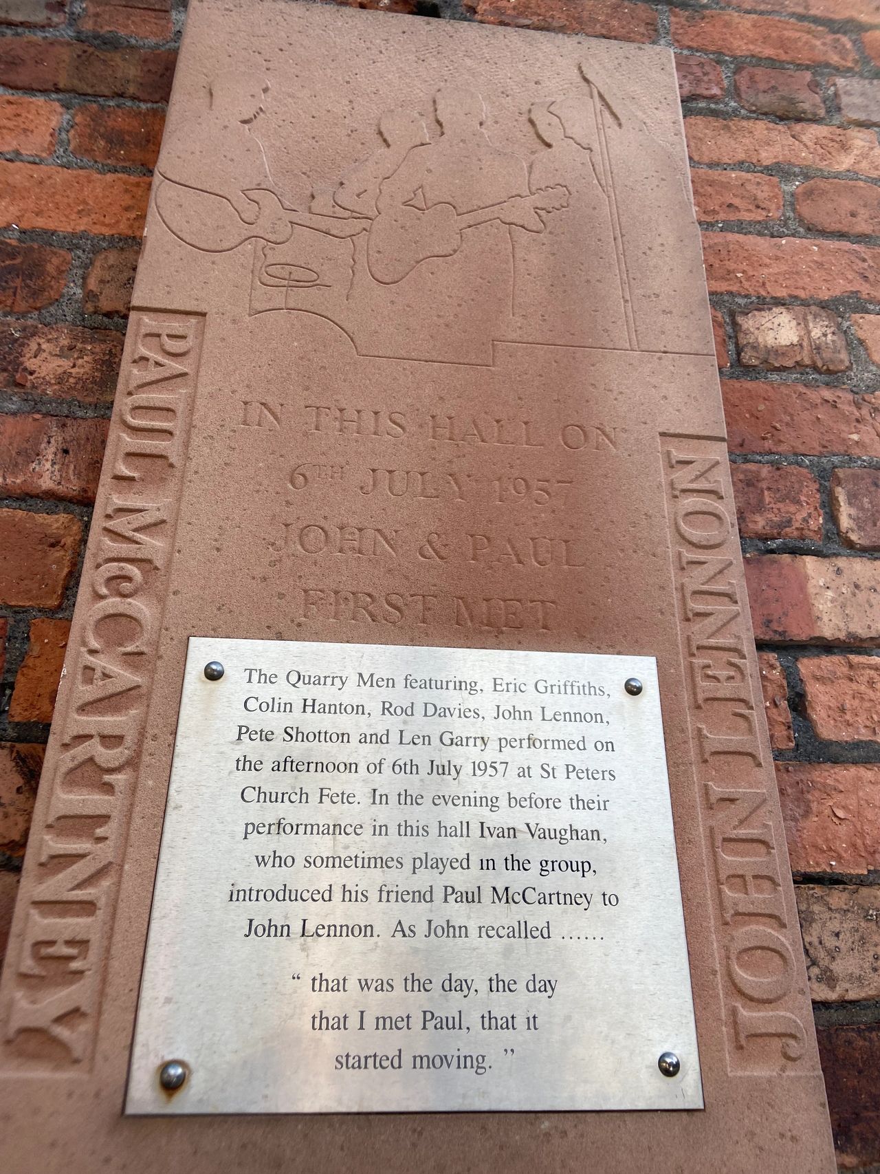 A plaque on the outside of the hall at St. Peter's church in Liverpool that memorialized that fateful summer day with Lennon finally met McCartney.