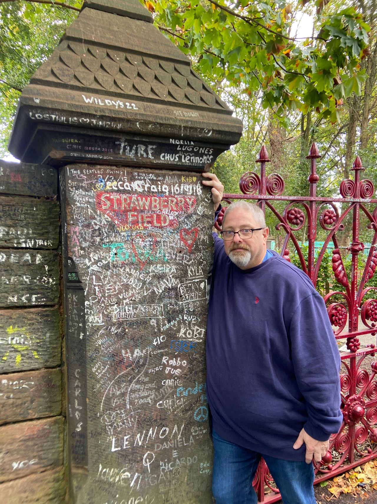Outside the gates to Strawberry Fields in Liverpool. It is a must stop photo opportunity on your Beatles tour.