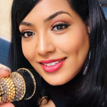 Close-up of a woman smiling with bracelets.