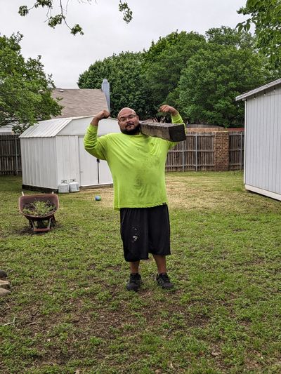 Herrera Hauling Junk Removal cleaning out a backyard in fort worth Texas 