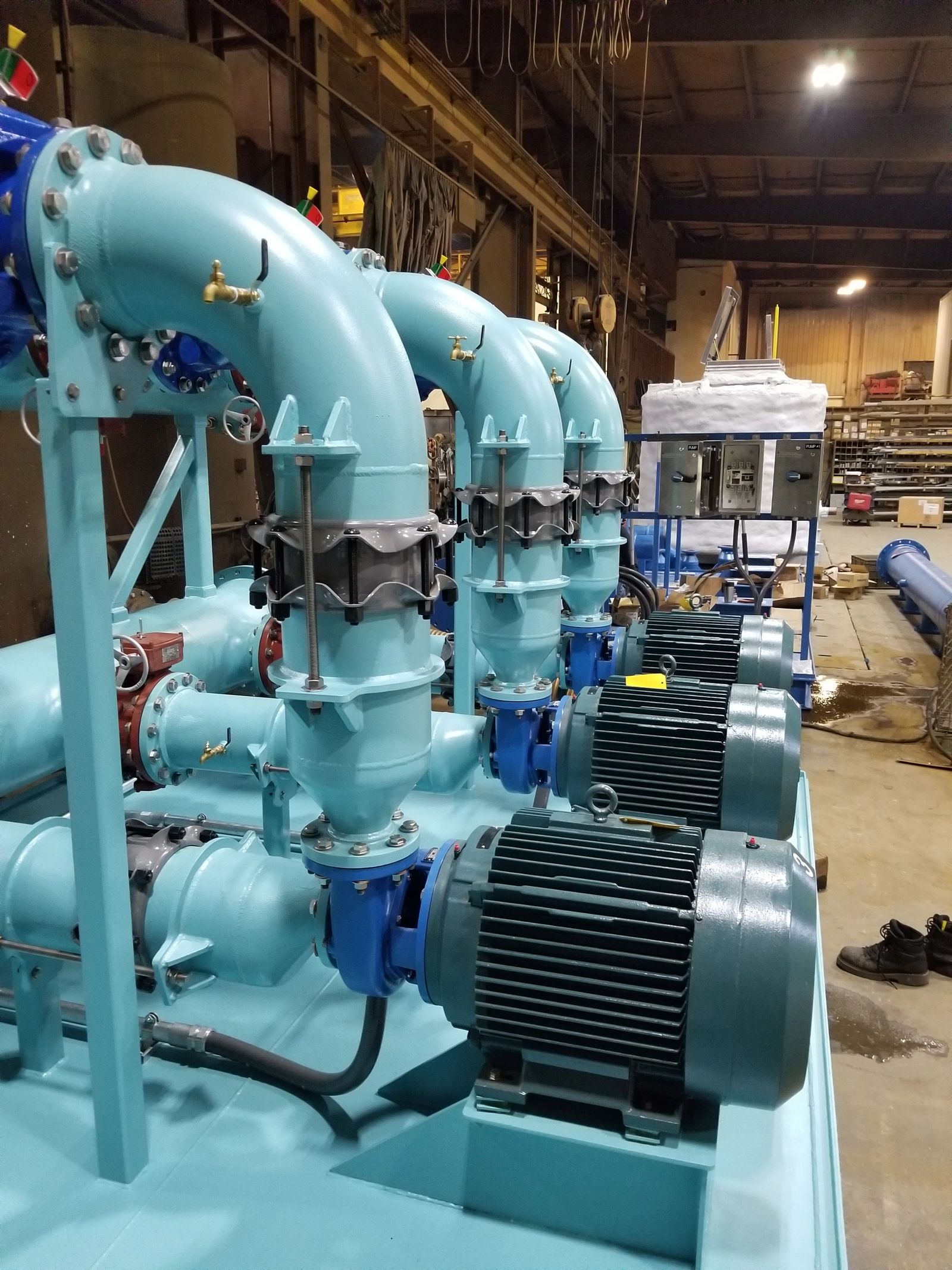 Skid mounted water booster assembly