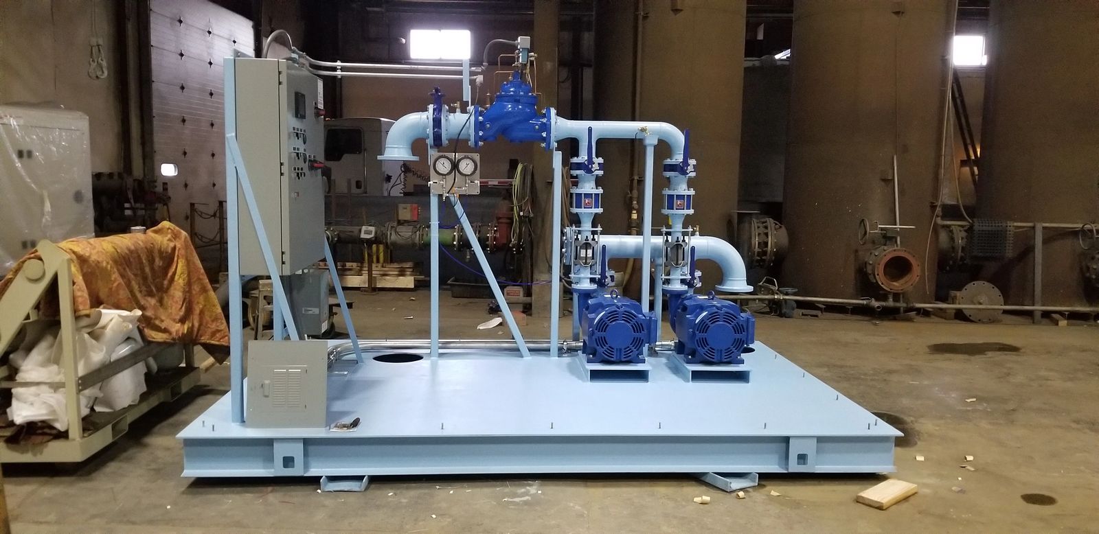 Skid mounted booster valves and controls