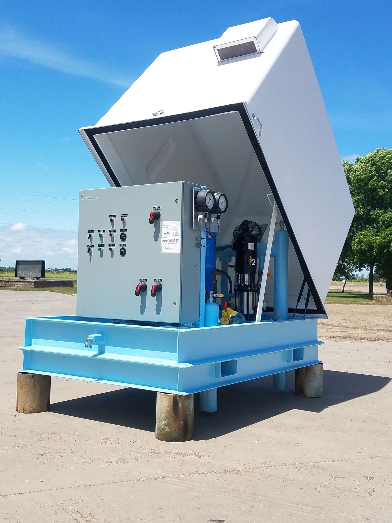 Angled view of above grade water booster components