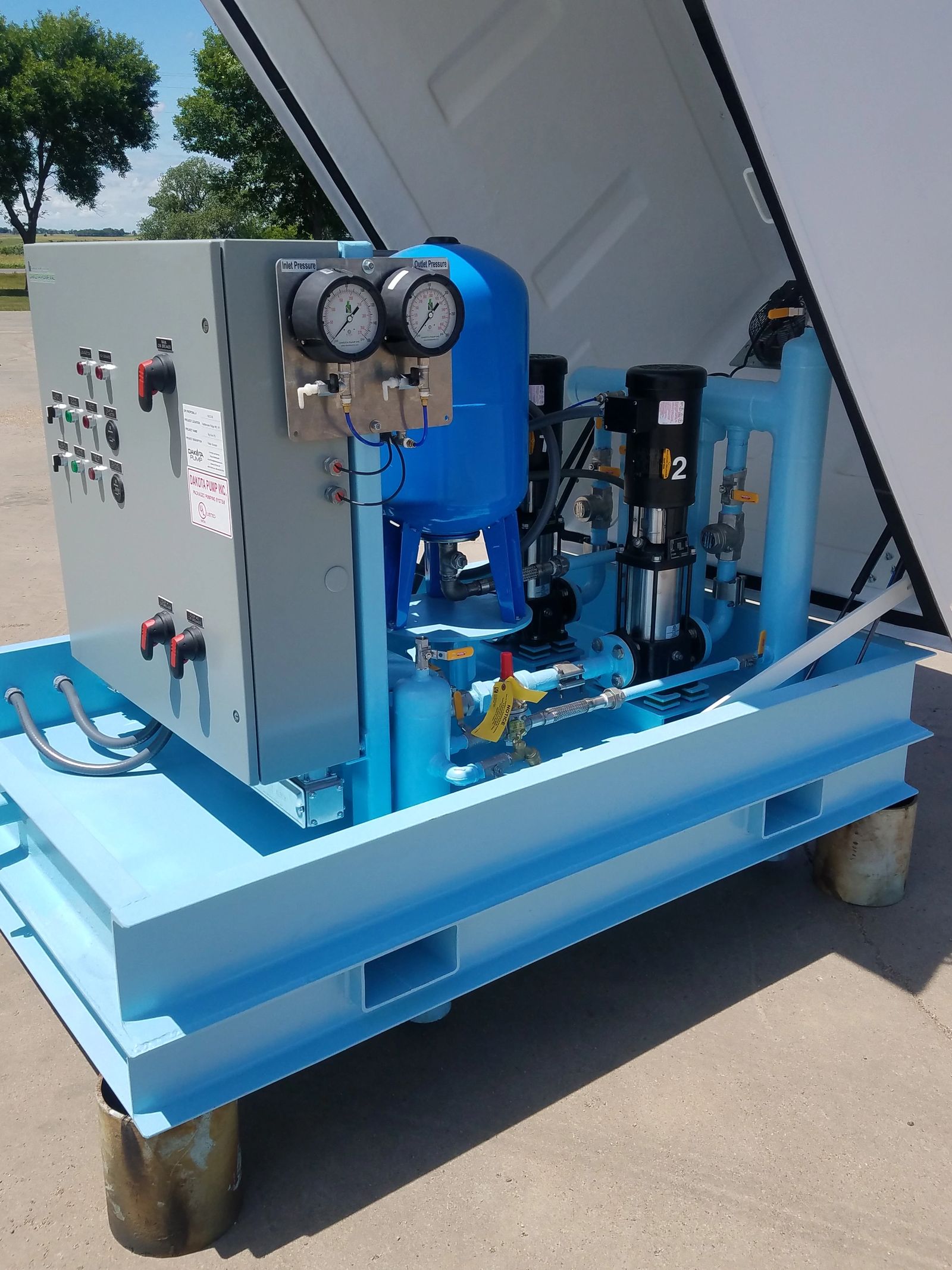 Close view of above grade water booster components